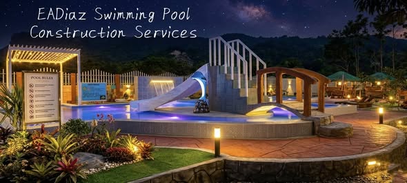 Pool, slide and landscaped surroundings lit at night